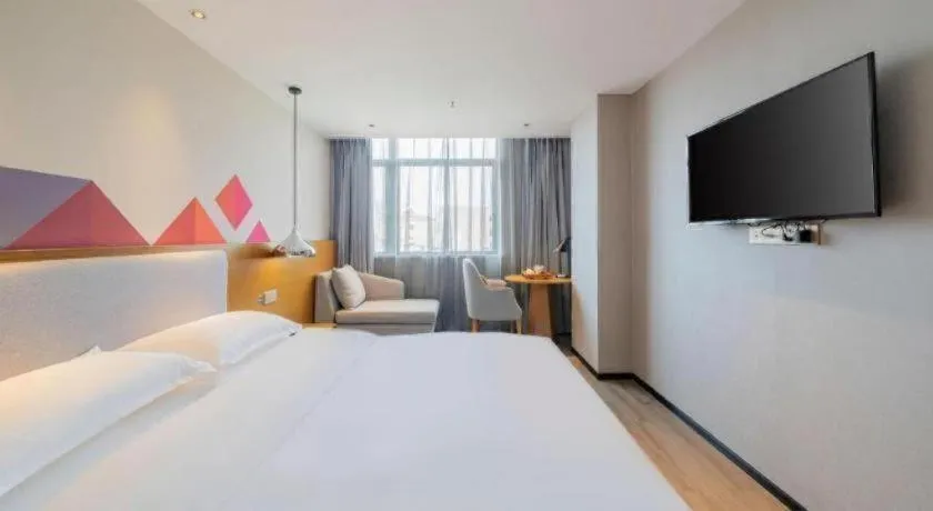 Bed in Borrman Hotel Zhanjiang Wuchuan Jinsha Plaza