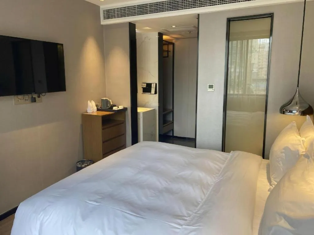 Bed in Borrman Hotel Zhanjiang Wuchuan Jinsha Plaza