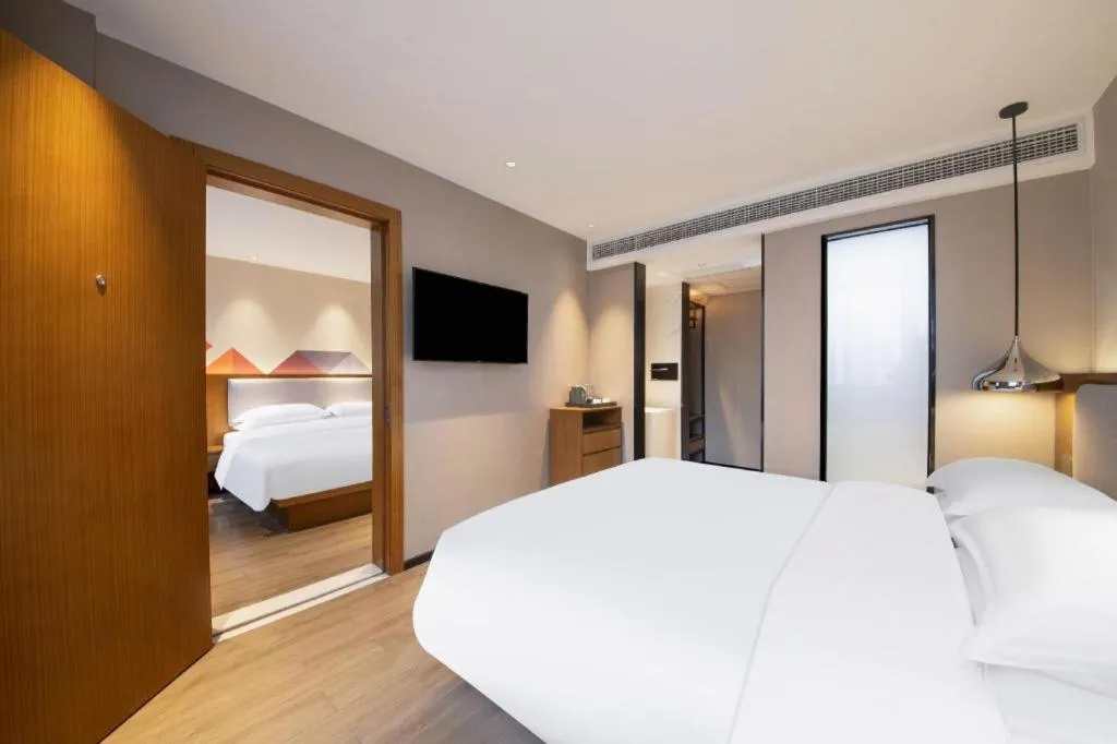 Bed in Borrman Hotel Zhanjiang Wuchuan Jinsha Plaza