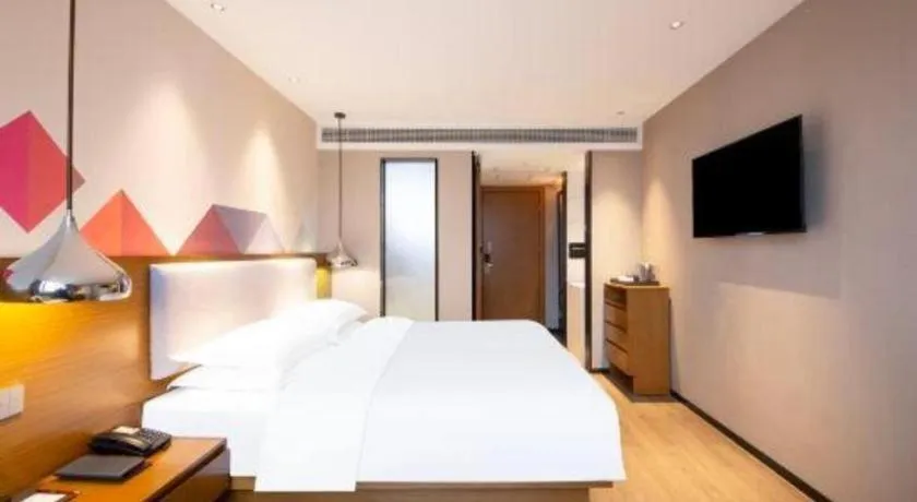 Bed in Borrman Hotel Zhanjiang Wuchuan Jinsha Plaza