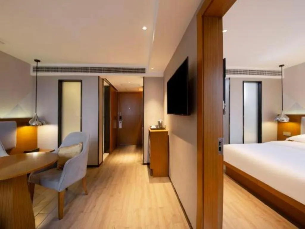 Bed in Borrman Hotel Zhanjiang Wuchuan Jinsha Plaza