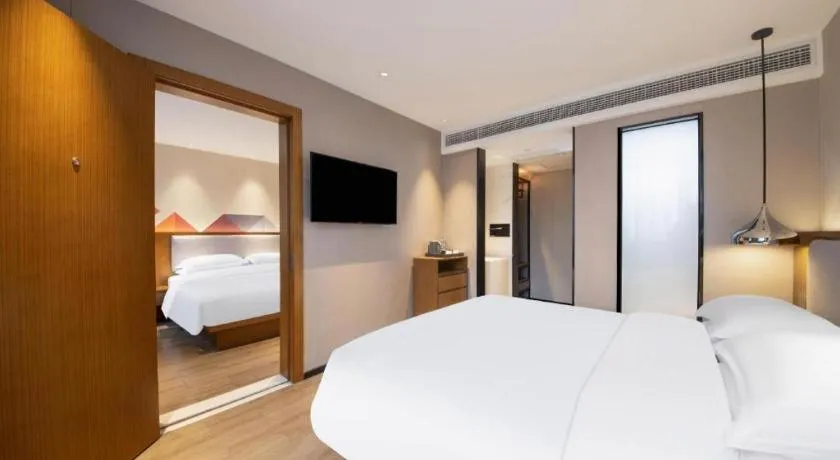 Bed in Borrman Hotel Zhanjiang Wuchuan Jinsha Plaza