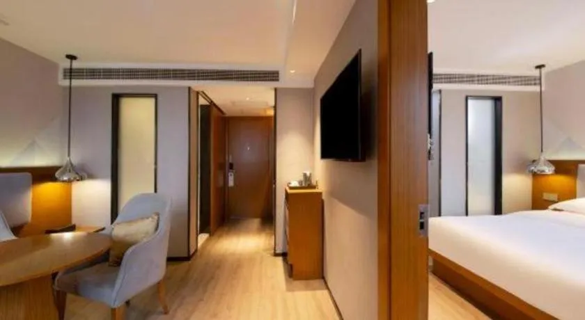 Bed in Borrman Hotel Zhanjiang Wuchuan Jinsha Plaza