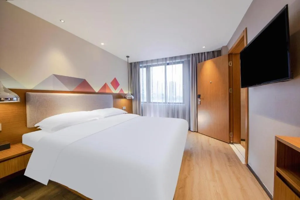 Bed in Borrman Hotel Zhanjiang Wuchuan Jinsha Plaza