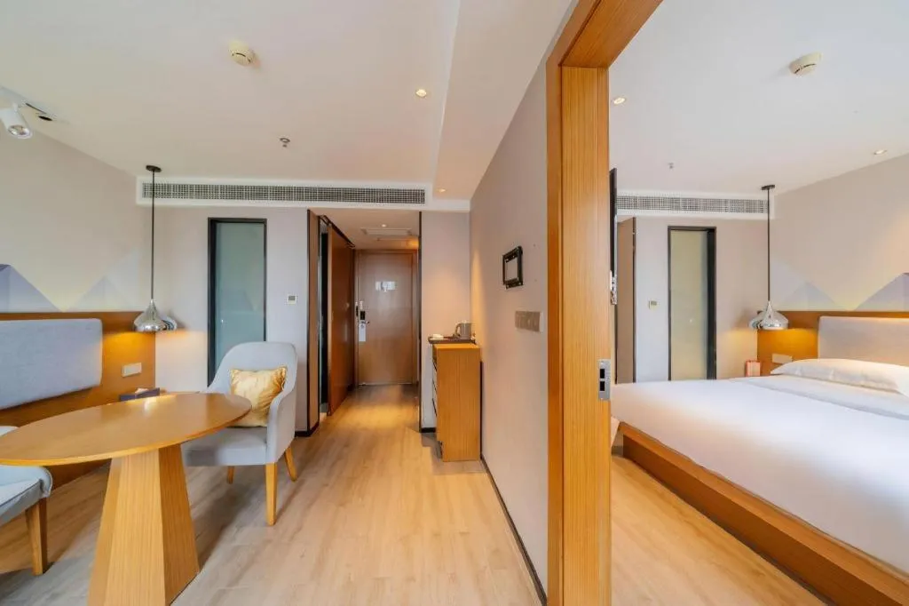 Bed in Borrman Hotel Zhanjiang Wuchuan Jinsha Plaza