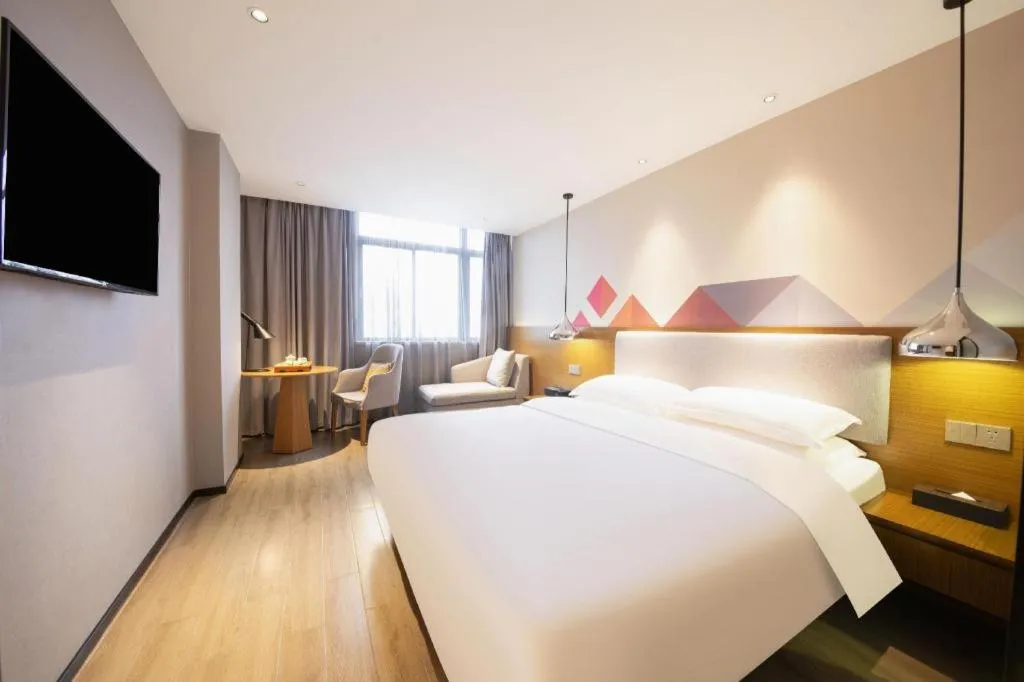Bed in Borrman Hotel Zhanjiang Wuchuan Jinsha Plaza