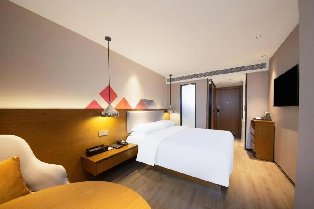 Bed in Borrman Hotel Zhanjiang Wuchuan Jinsha Plaza