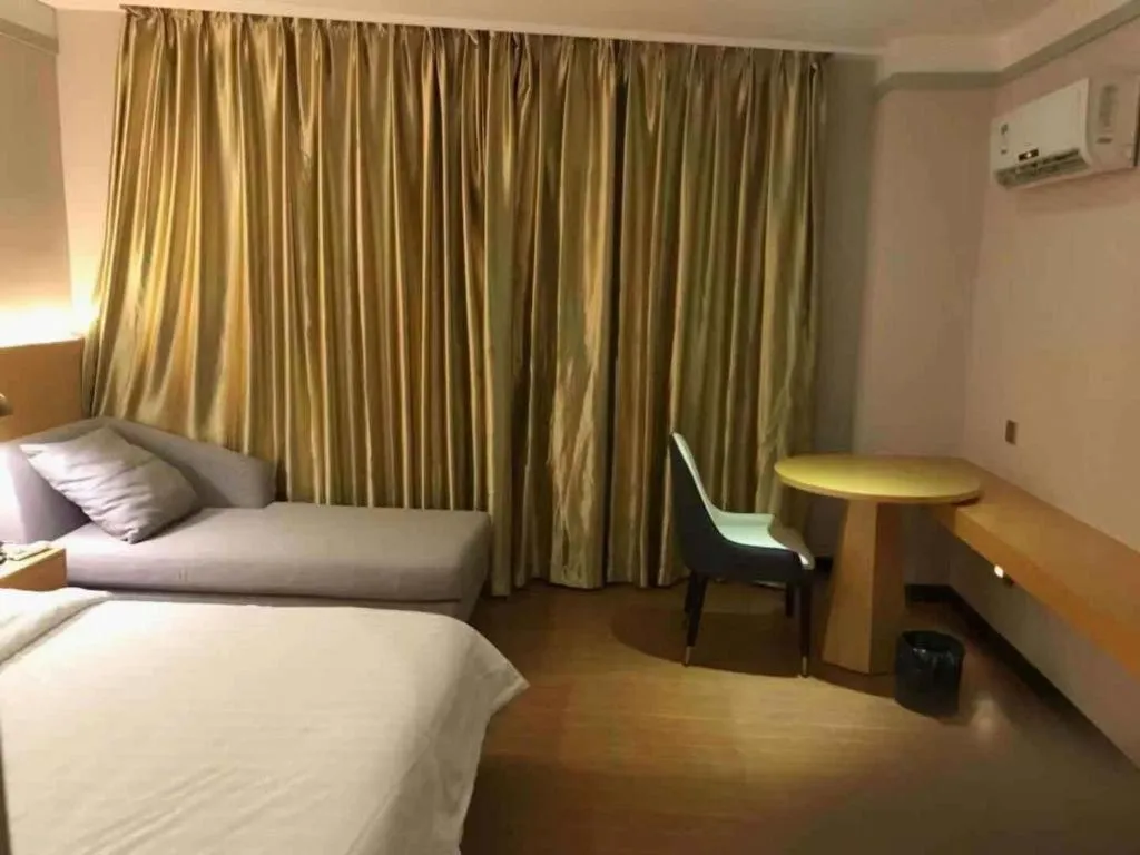 Bed in Borrman Hotel Dongguan Zhongtang