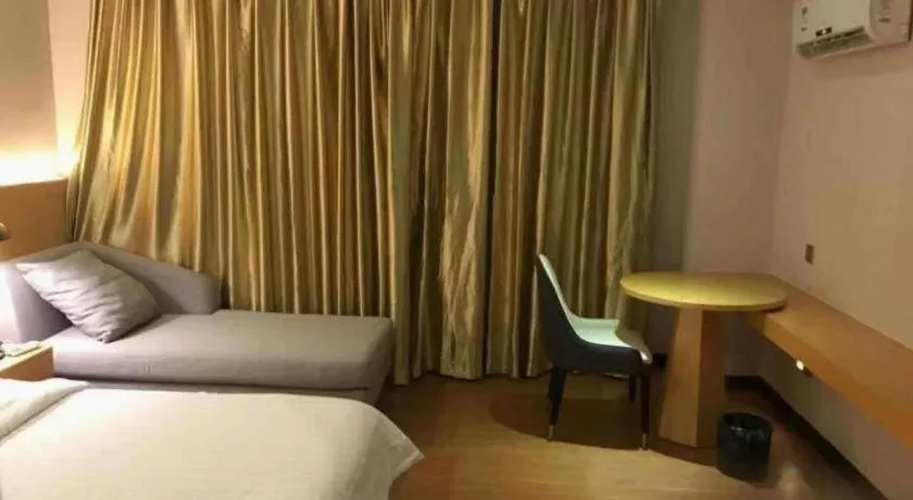 Bed in Borrman Hotel Dongguan Zhongtang