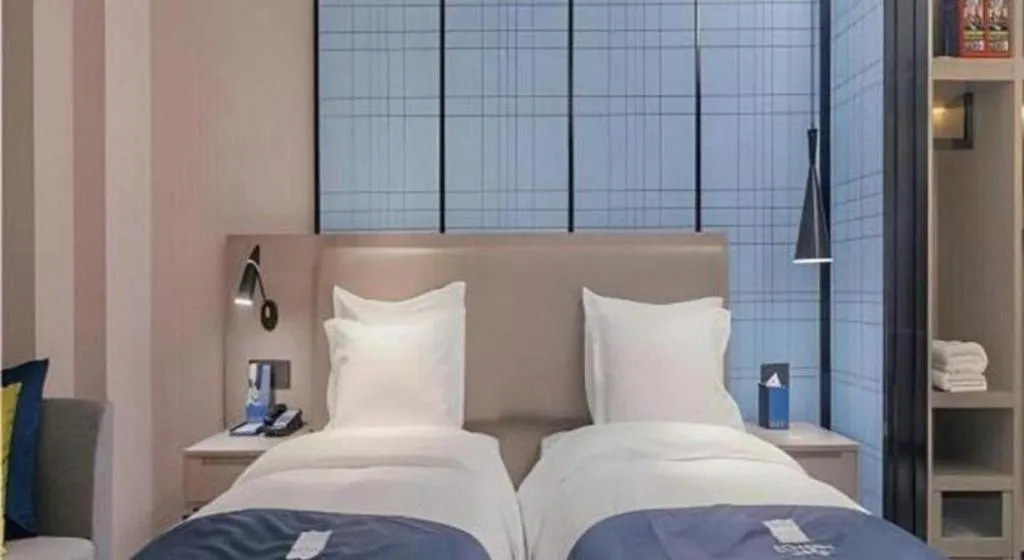 Bed in Echarm Hotel Wuhan Huangpi Xiangyang Avenue
