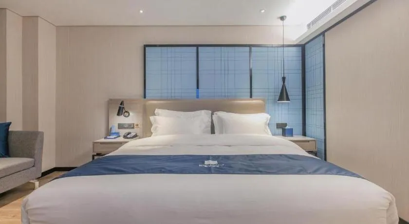 Bed in Echarm Hotel Wuhan Huangpi Xiangyang Avenue