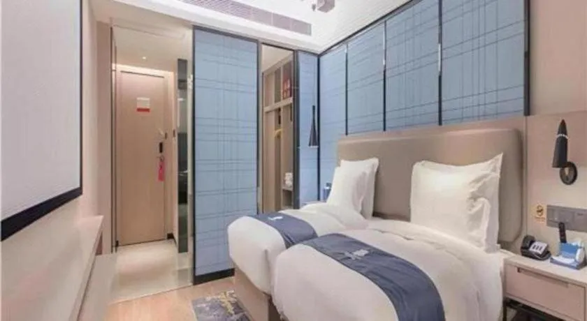 Bed in Echarm Hotel Wuhan Huangpi Xiangyang Avenue