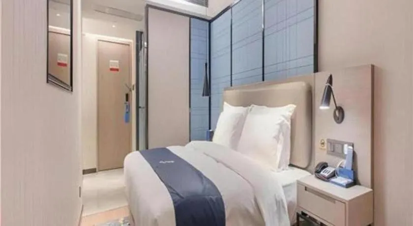 Bed in Echarm Hotel Wuhan Huangpi Xiangyang Avenue