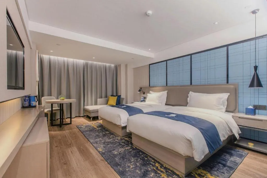 Bed in Echarm Hotel Wuhan Huangpi Xiangyang Avenue