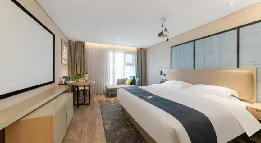 Bed in Echarm Hotel Wuhan Huangpi Xiangyang Avenue