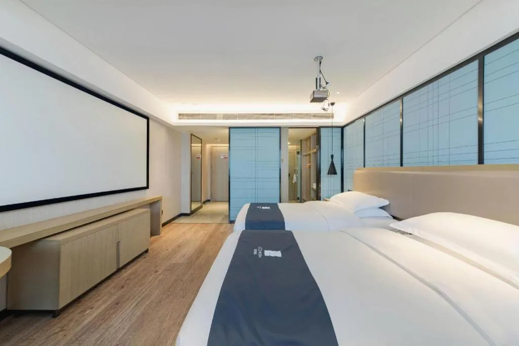 Bed in Echarm Hotel Wuhan Huangpi Xiangyang Avenue