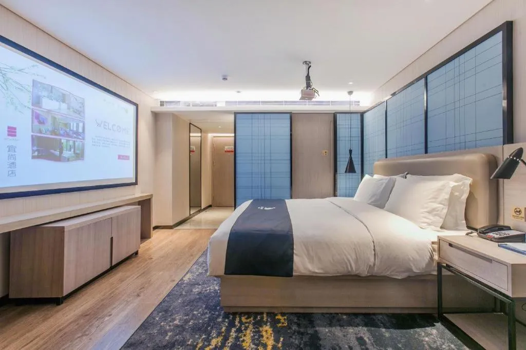 Bed in Echarm Hotel Wuhan Huangpi Xiangyang Avenue