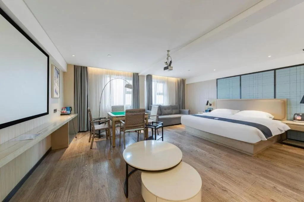 Bed in Echarm Hotel Wuhan Huangpi Xiangyang Avenue