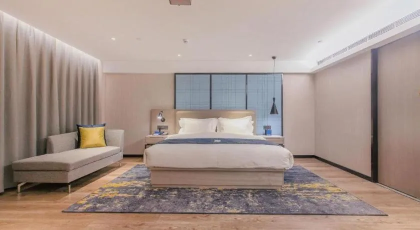 Bed in Echarm Hotel Wuhan Huangpi Xiangyang Avenue