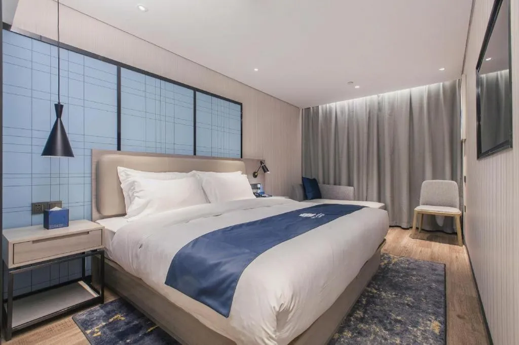 Bed in Echarm Hotel Wuhan Huangpi Xiangyang Avenue