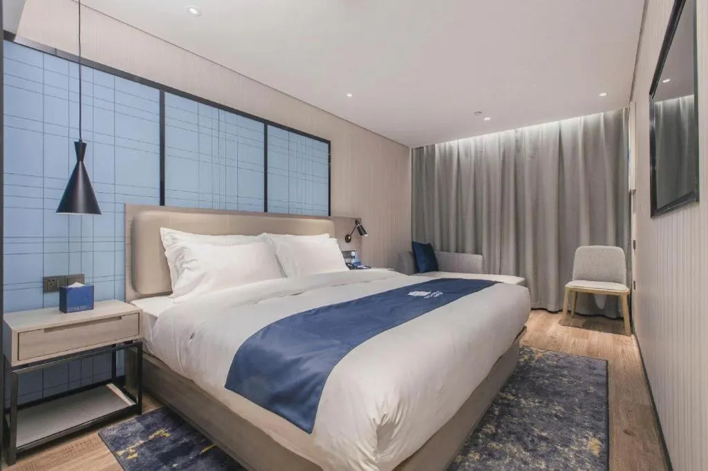 Bed in Echarm Hotel Wuhan Huangpi Xiangyang Avenue