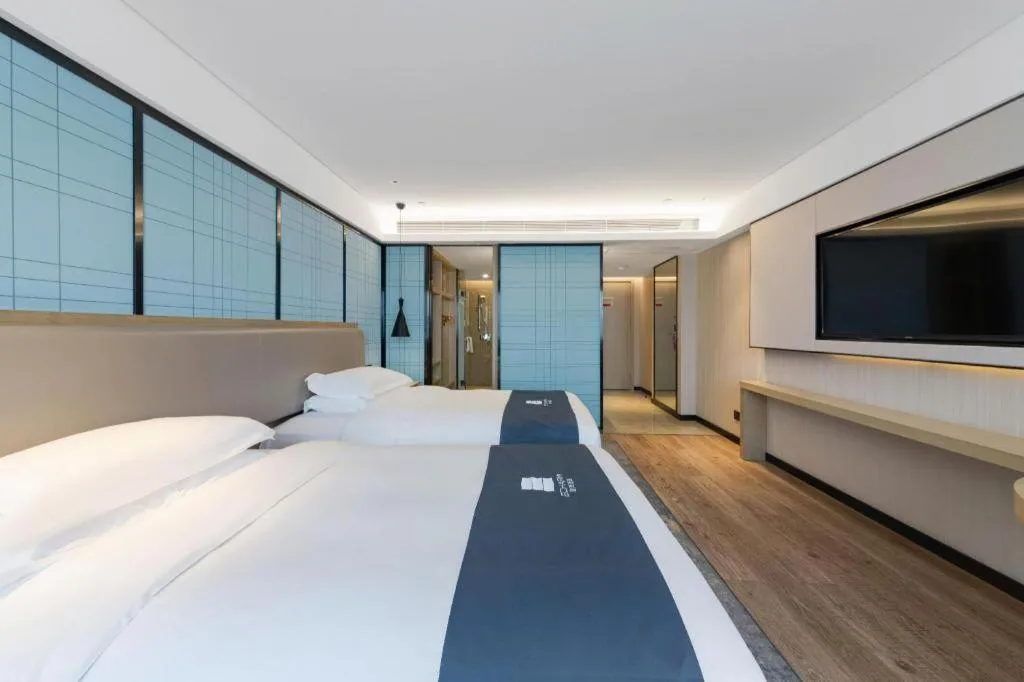 Bed in Echarm Hotel Wuhan Huangpi Xiangyang Avenue