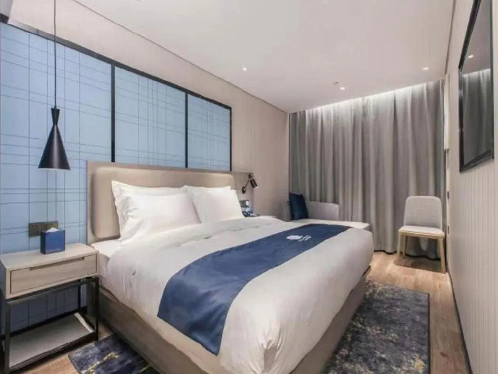 Bed in Echarm Hotel Wuhan Huangpi Xiangyang Avenue