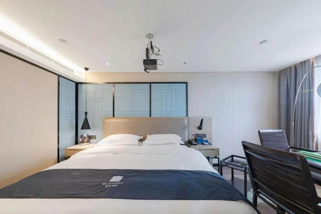 Bed in Echarm Hotel Wuhan Huangpi Xiangyang Avenue