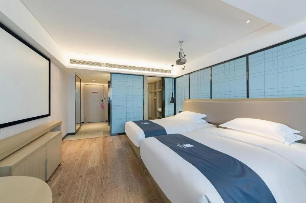 Bed in Echarm Hotel Wuhan Huangpi Xiangyang Avenue