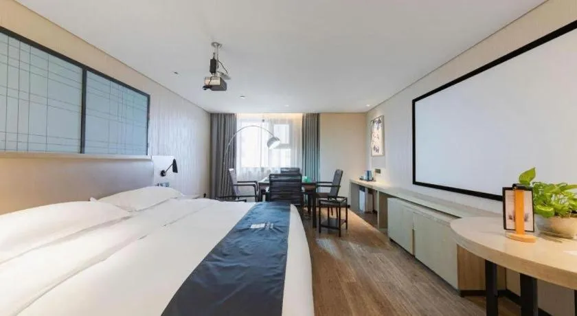 Bed in Echarm Hotel Wuhan Huangpi Xiangyang Avenue