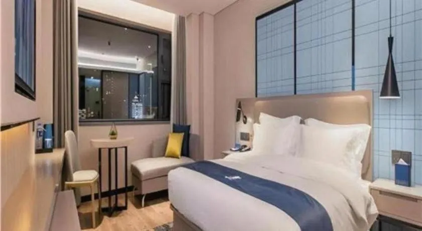 Bed in Echarm Hotel Wuhan Huangpi Xiangyang Avenue