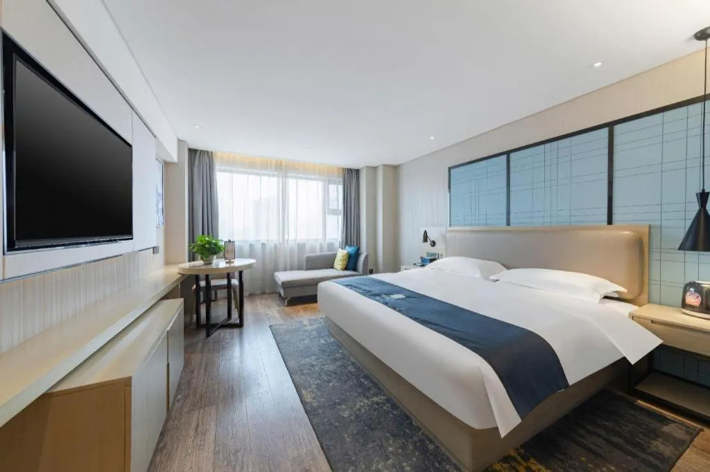 Bed in Echarm Hotel Wuhan Huangpi Xiangyang Avenue