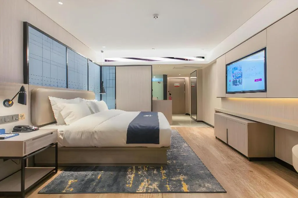 Bed in Echarm Hotel Wuhan Huangpi Xiangyang Avenue