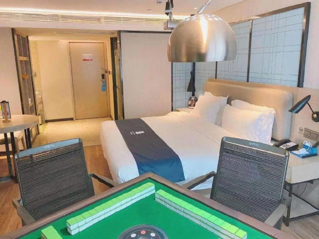 Bed in Echarm Hotel Wuhan Huangpi Xiangyang Avenue