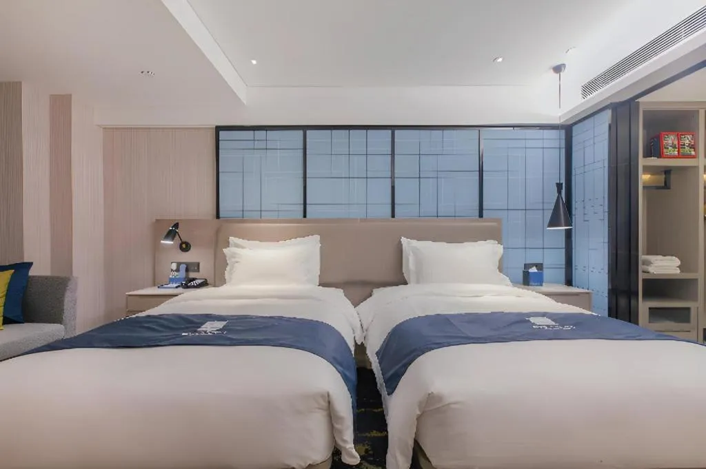 Bed in Echarm Hotel Wuhan Huangpi Xiangyang Avenue