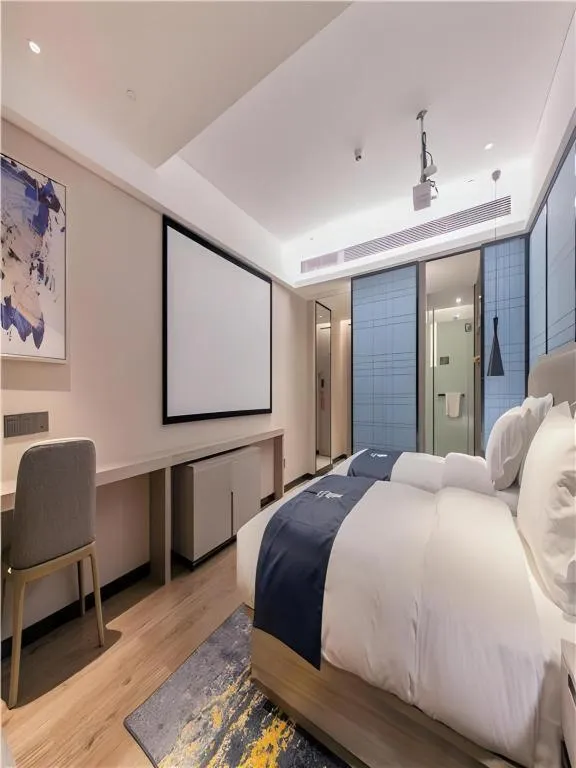 Bed in Echarm Hotel Wuhan Huangpi Xiangyang Avenue