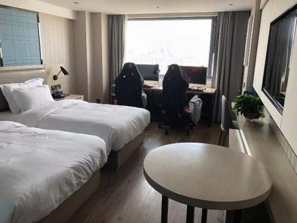 Bed in Echarm Hotel Wuhan Huangpi Xiangyang Avenue