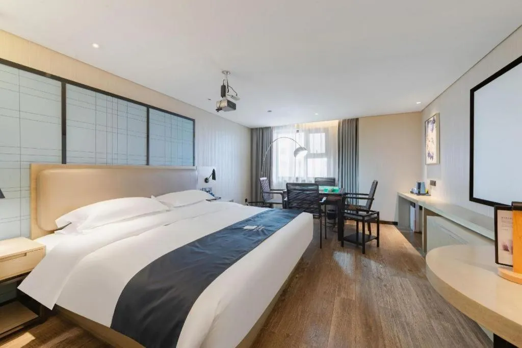 Bed in Echarm Hotel Wuhan Huangpi Xiangyang Avenue