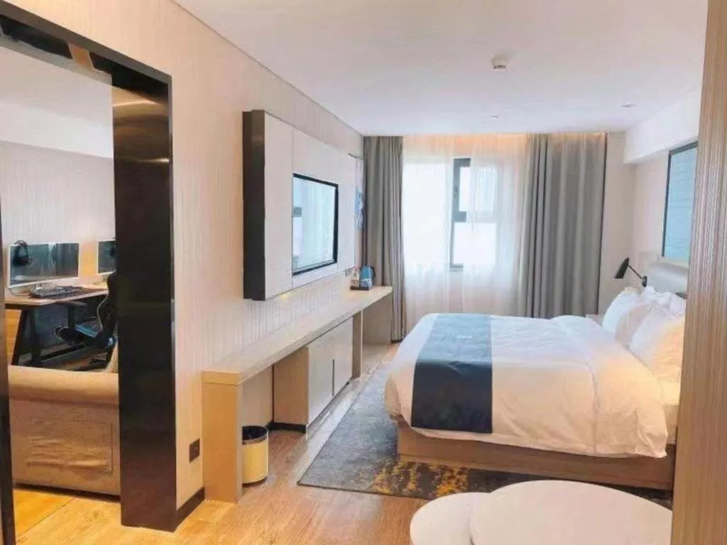 Bed in Echarm Hotel Wuhan Huangpi Xiangyang Avenue