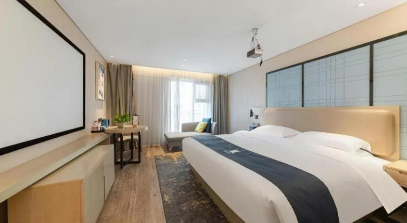 Bed in Echarm Hotel Wuhan Huangpi Xiangyang Avenue