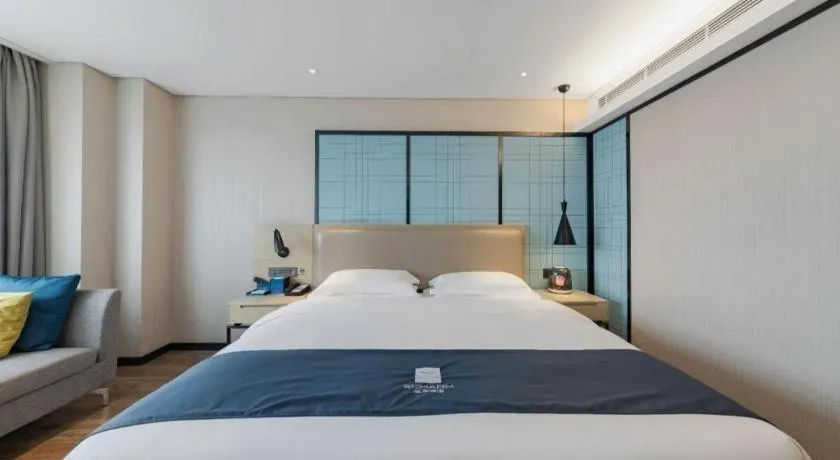 Bed in Echarm Hotel Wuhan Huangpi Xiangyang Avenue