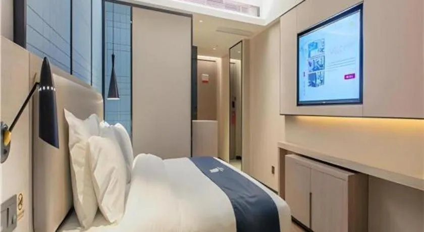 Bed in Echarm Hotel Wuhan Huangpi Xiangyang Avenue