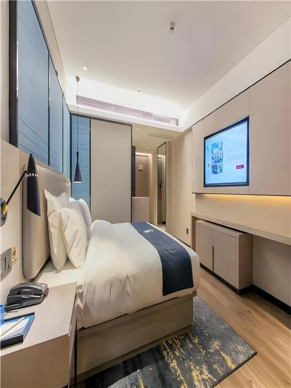 Bed in Echarm Hotel Wuhan Huangpi Xiangyang Avenue