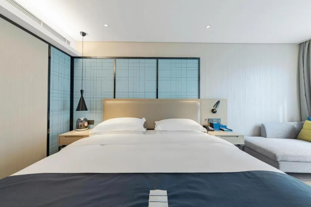 Bed in Echarm Hotel Wuhan Huangpi Xiangyang Avenue