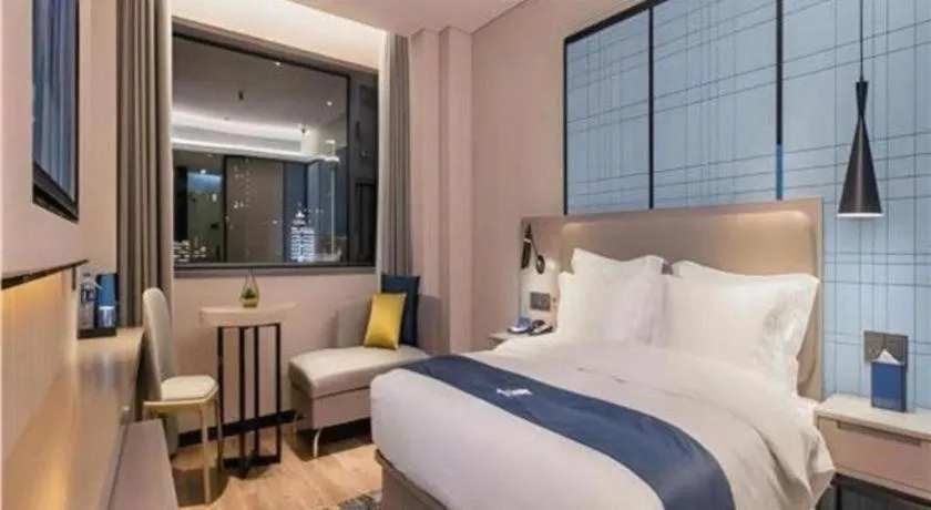 Bed in Echarm Hotel Wuhan Huangpi Xiangyang Avenue