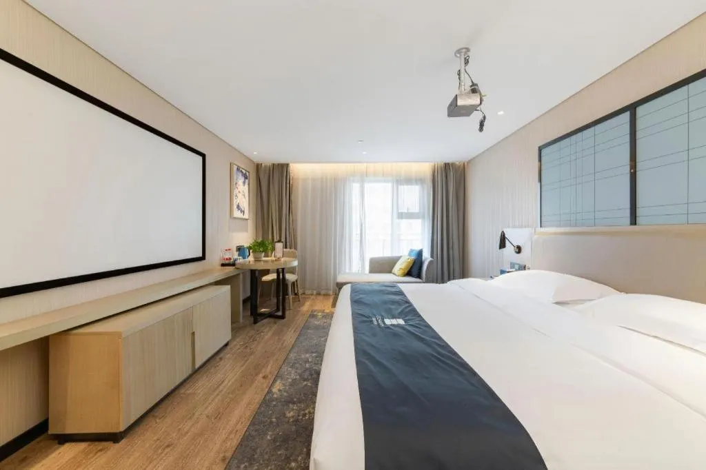 Bed in Echarm Hotel Wuhan Huangpi Xiangyang Avenue