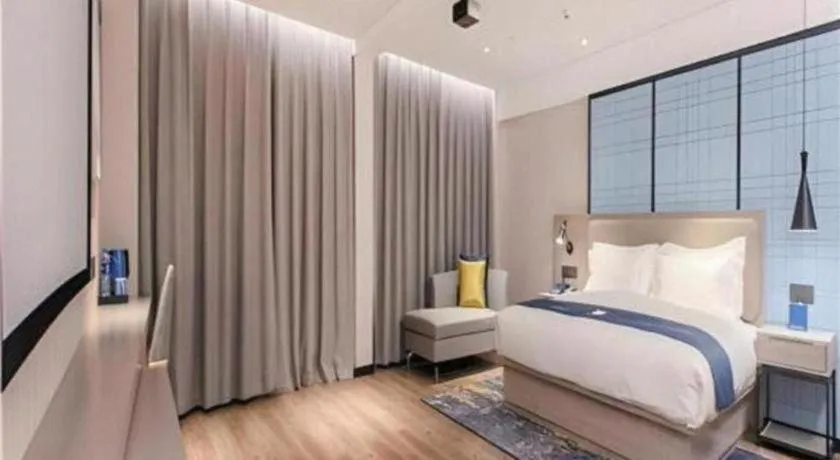 Bed in Echarm Hotel Wuhan Huangpi Xiangyang Avenue