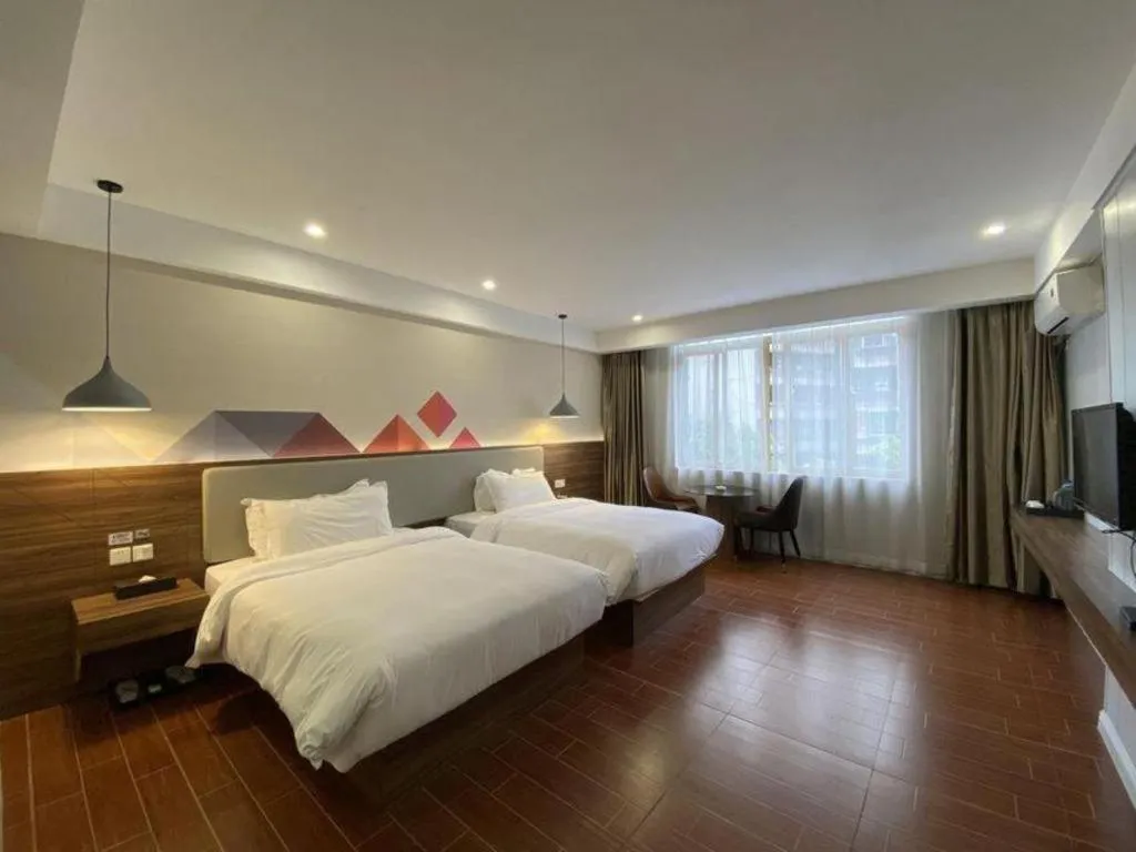 Bed in Borrman Hotel Shaoguan Century East Street Fengcai Building