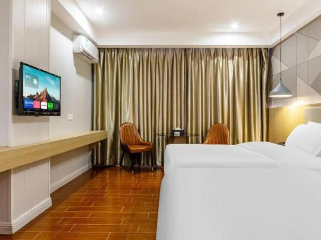 Bed in Borrman Hotel Shaoguan Century East Street Fengcai Building