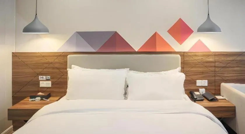 Bed in Borrman Hotel Shaoguan Century East Street Fengcai Building